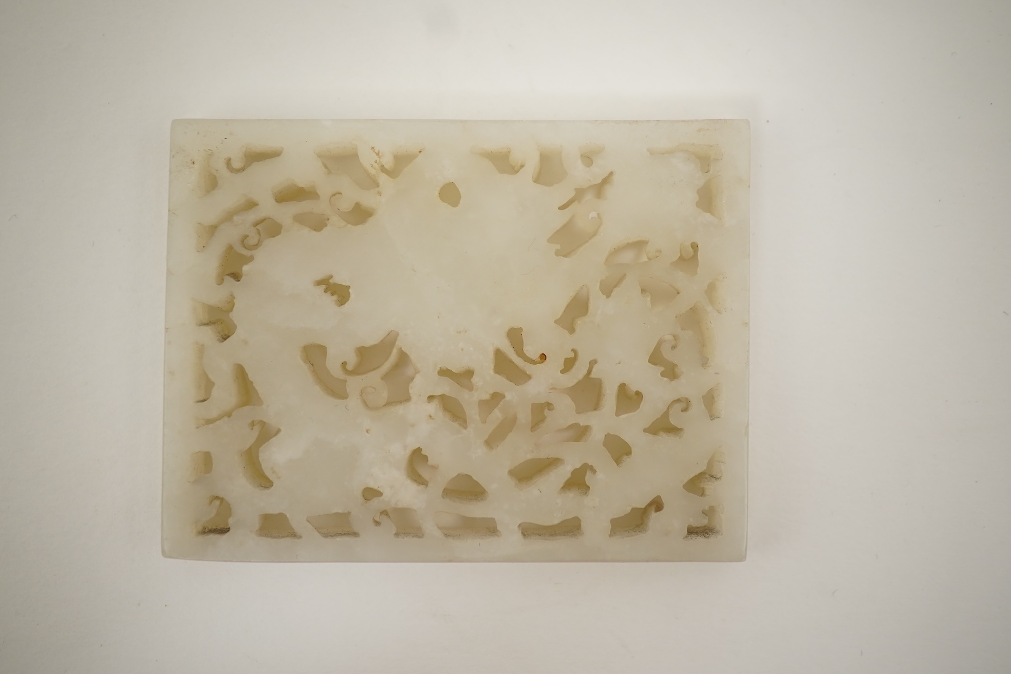 A Chinese reticulated white jade ‘dragon’ plaque, 18th century